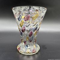 Front view of iridescent glass vase showing multicolored raised ovals