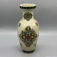 Front view of crackle-glazed porcelain vase with floral motif