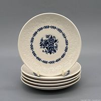 Stack of five saucers showing top design