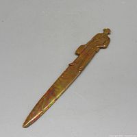 Full view of letter opener showing overall shape and marbled colouring