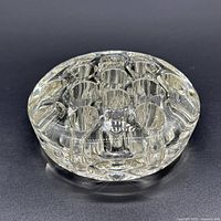 Top view showing fourteen holes and clear glass body