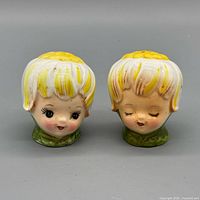 Front view of both ceramic flower-head shakers