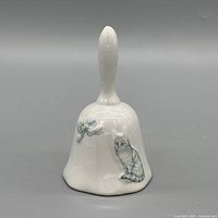 Front view showing cat relief, floral bow, overall shape