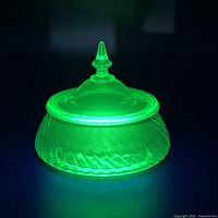 Dish glowing under UV light showing fluorescence