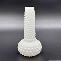 front view of white hobnail milk glass vase