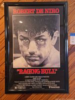 Full view of framed Raging Bull poster showing image and text