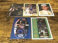 All five basketball cards laid out face-up