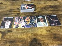 Stack of cards and five individual cards displayed