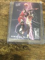 Front of Dominique Wilkins Scoring Kings card in top loader