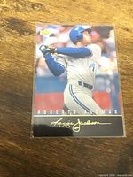 Front of sleeved 1993 Upper Deck Roberto Alomar card showing player image and facsimile signature