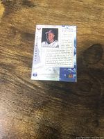 Back of Albert Belle limited edition holographic card showing portrait, bio and limited edition marking