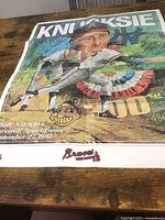 Full view of folded Phil Niekro farewell poster on table