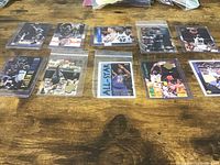 All 10 Shaquille O’Neal cards laid out in sleeves/top loaders