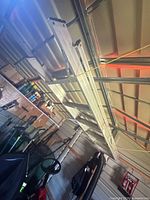 Ladder suspended from ceiling showing overall length and rails