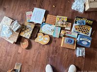 Group shot of all nine game sets spread on floor