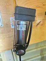 Close-up of CCM pump cylinder, foot plate and gauge