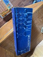 Closed Claudia box showing brand name and glass silhouettes