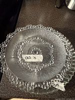 Top view of beaded rim relish server showing swirl texture and overall condition