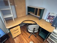 Overall view of L-shaped desk with hutch, pedestal, shelf unit and chair