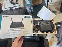 Router, power adapter, guide and box displayed together