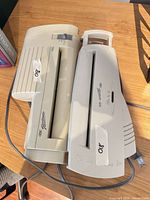 Two GBC laminators side by side showing model labels and cords