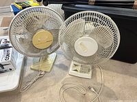 Front view of both 12-inch fans showing size, style and discoloration
