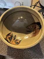 Interior view showing leaf decoration and glaze