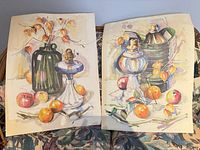 Both unframed Paquette still-life prints displayed side by side