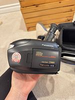 Left side of Panasonic PV-L459 camcorder showing model, 150x/26x zoom labels