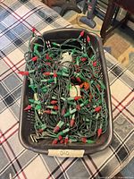 Top view of tangled LED light strands in basket