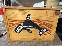 Front view showing orca artwork and signature