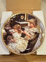 Front view of plate showing artwork and gilt border