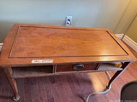 Side table front angle showing top, drawer, and shelf