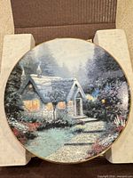 Front view of decorative plate in box