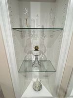 Full view of oil lamp displayed on shelf