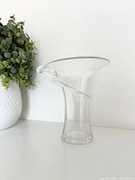 Side view of clear crystal vase showing flared rim and wrapped accent
