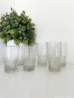 Full set of five textured glasses standing