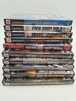 Stack of all ten PS2 game cases