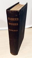 Spine view showing title, author initials, publisher imprint, wear to cloth