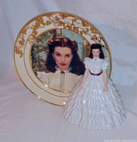 Front view of plate featuring Scarlett portrait and figurine standing in front
