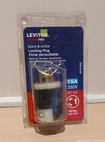 Front view of sealed Leviton locking plug package