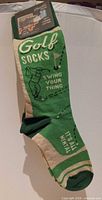 Front view showing Golf Socks graphic and attached tag