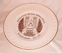 Front view of plate showing illustration, text, and gold rim