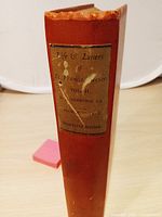 Spine showing title, author, edition on paper label, cloth color and wear to spine ends