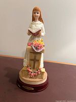 Front view of Da Vinci Collection figurine showing woman at pulpit