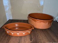 Both terracotta dishes side by side showing sizes and shape