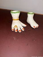 Hand and foot figurines side by side