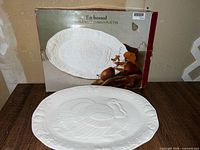Platter displayed in front of original box