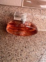 Full view of Céline Dion perfume bottle on countertop