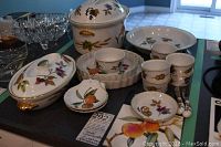 Group of Royal Worcester Evesham dishes arranged on counter showing full lot